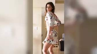 Beautiful brunette babe stripping at home