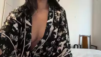 Pretty Brunette Playing With Her Big Boobs In A Sexy Robe In This Seductive Video