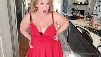 fantasymilfursula teasing her massive tits and big ass in a red dress in the kitchen in this OnlyFans video