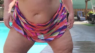 fantasymilfursula teasing in a bikini by the pool in this steamy OnlyFans video