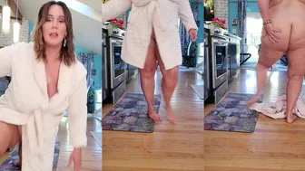 Ursula Andreia aka fantasymilfursula flashes her pussy while teasing in a bathrobe in the kitchen in this OnlyFans video