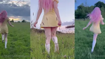 BelleDelphine Teases in Yellow Dress and White Stockings in Outdoor Field Video from OnlyFans