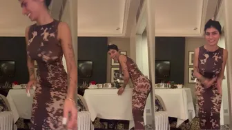 Mia Khalifa Teases Her Massive Juggs in Strip Show Video